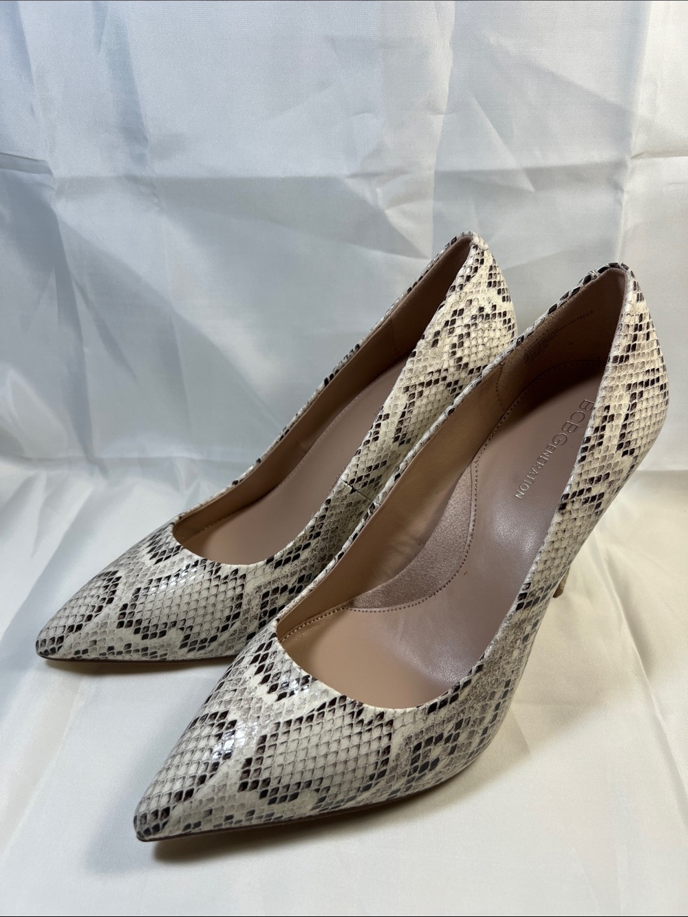 BCBGeneration Snake-Print Pointed Pumps in Cream and Black